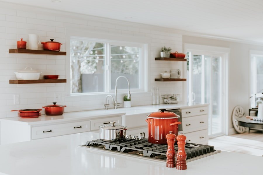 Modern kitchen with stone counter, brass fittings and fresh coffee set out for arriving guests