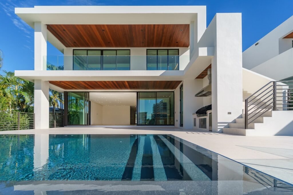 Contemporary villa exterior with pool and lounge seating at Willow Court Villa